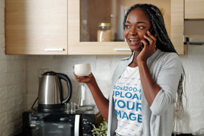 T-Shirt Mockup of a Happy Woman Talking on the Phone at Home