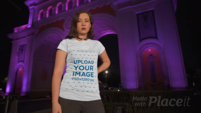 T-Shirt Video of a Woman Posing at Night by an Urban Arch