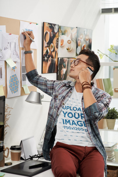 T-Shirt Mockup of a Man Talking on the Cellphone at an Office M4204-r-el2