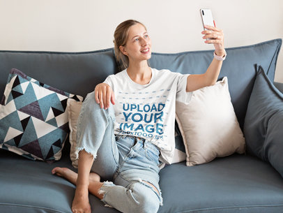 T-Shirt Mockup of a Woman Making a Video Call at Home