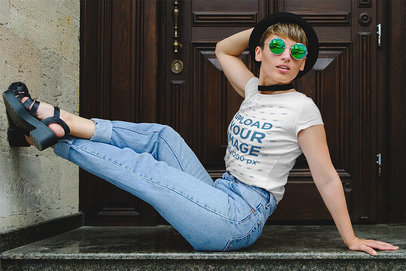 Round-Neck Tee Mockup of a Young Woman Posing by a Wooden Door