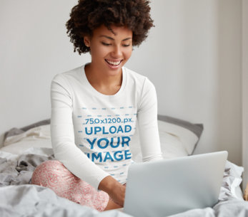 Long Sleeve Tee Mockup Featuring a Happy Woman Using a Laptop