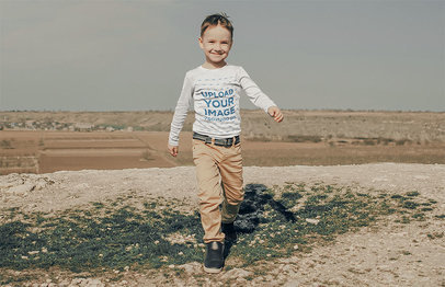 Long Sleeve Tee Mockup of a Little Kid Running on a Meadow