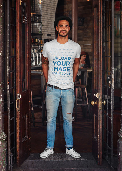 Mockup Featuring a Happy Tattooed Man Wearing a Heather T-Shirt 