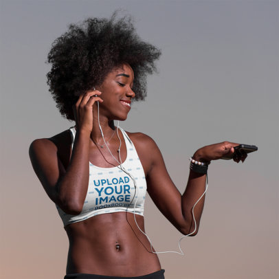 Sports Bra Mockup of a Woman Enjoying Her Running Playlist