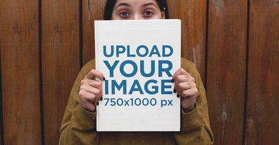 Facebook Ad - Girl Holding a Book While Against a Wooden Wall a23