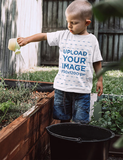 T-Shirt Mockup of a Little Boy Watering the Plants of a Garden 44346r-el2
