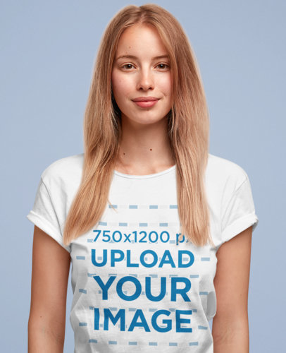 T-Shirt Mockup of a Woman Standing in a Studio