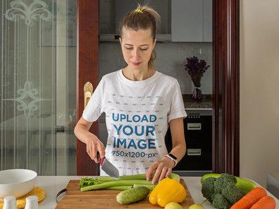 Basic T-Shirt Mockup of a Woman Cutting Vegetables 