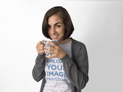 Smiling Hispanic Woman Wearing a Tee Mockup While Holding a Cup of Coffee