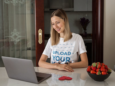 T-Shirt Mockup of a Woman Making a Video Call From Home