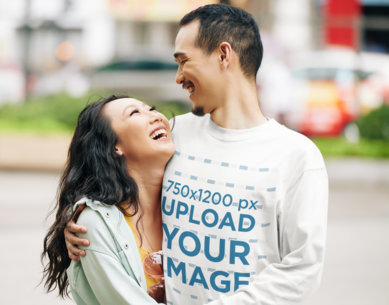Long Sleeve Tee Mockup of a Smiling Man Hugging His Girlfriend