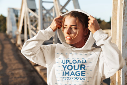 Pullover Hoodie Mockup Featuring a Woman in an Urban Setting