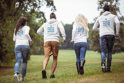 Hoodie Mockup of Four Friends Running at a Park
