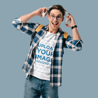 Round-Neck Tee Mockup of a Joyful Man Putting on a Pair of Headphones