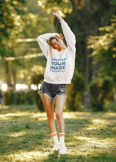Sweatshirt Mockup of a Woman Posing at a Park