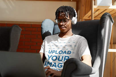 T-Shirt Mockup of a Young Woman Working From Home