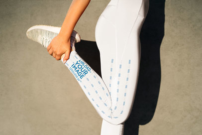 Side Leggings Mockup Featuring a Woman Stretching Her Leg