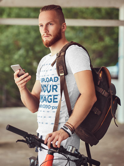 Mockup of a Red-Haired Bearded Cyclist Wearing a Heather Tee 37727-r-el2