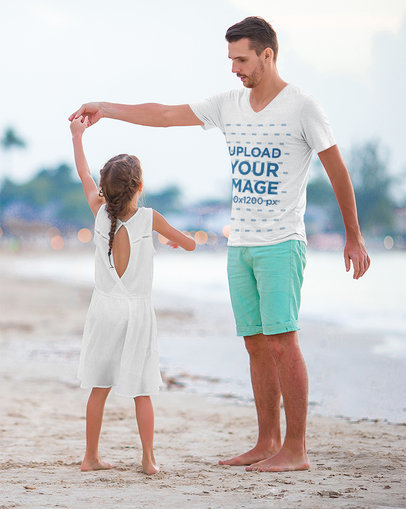 V-Neck T-Shirt Mockup Featuring a Father Dancing With His Daughter at the Beach
