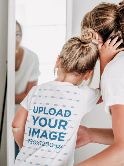 Back-View Tee Mockup of a Little Girl with Her Mom
