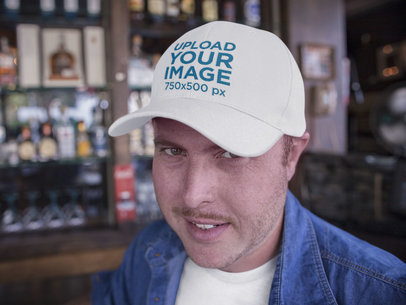 Middle Aged Guy with Dad Hat Mockup at a Bar a15885