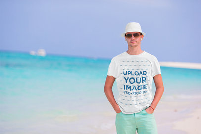 Heathered T-Shirt Mockup of a Serious Man on the Beach