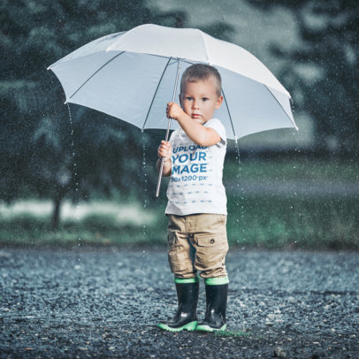 T-Shirt Mockup of a Little Boy Standing in the Rain