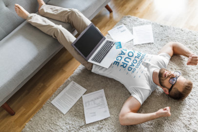 T-Shirt Mockup of a Bearded Man Lying on the Floor 
