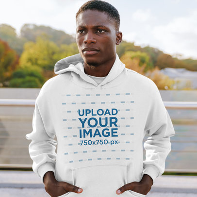 Hoodie Mockup Featuring a Young Man and Nature in the Background