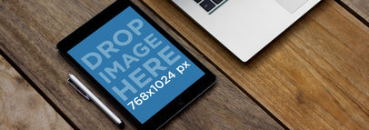 Mockup of a Black iPad Mini in Portrait Mode