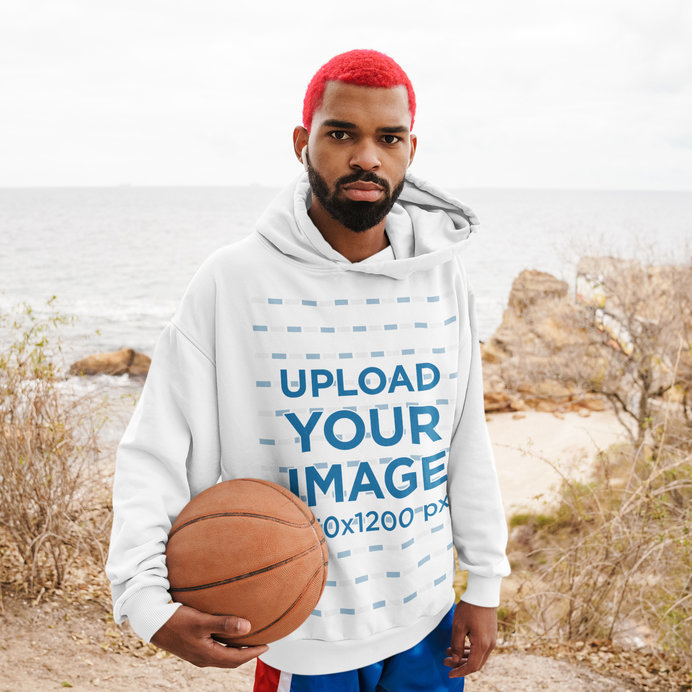 Pullover Hoodie of a Basketball Player with Dyed Hair Posing by the Beach