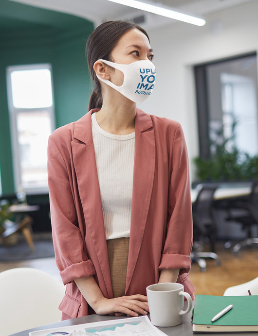 Mockup of a Woman Wearing a Face Mask at the Office