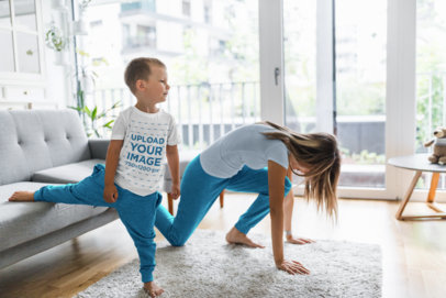 T-Shirt Mockup of a Boy Doing Yoga at Home with His Mom