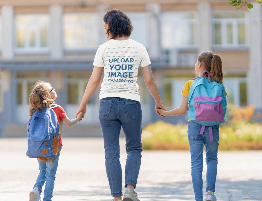 T-Shirt Mockup of a Mom Holding Her Girls' Hands While Walking to School