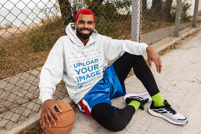 Hoodie Mockup Featuring a Man With Dyed Hair Playing Basketball