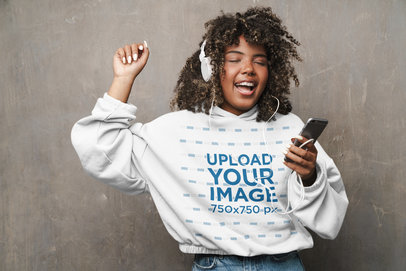Hoodie Mockup Featuring  a Cheerful Woman Listening to Music m5790 r-el2