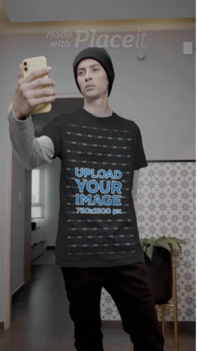 T-Shirt Video Featuring a Serious Young Man Taking a Selfie