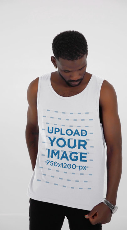 Tank Top Video Featuring a Serious Man Posing at a Studio