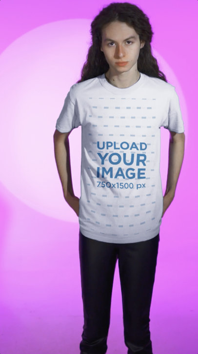 T-Shirt Video Featuring a Man With Long Curly Hair Posing at a Pink Surface 5755v