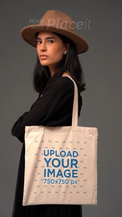 Video of a Serious Woman With a Brown Hat Holding a Tote Bag