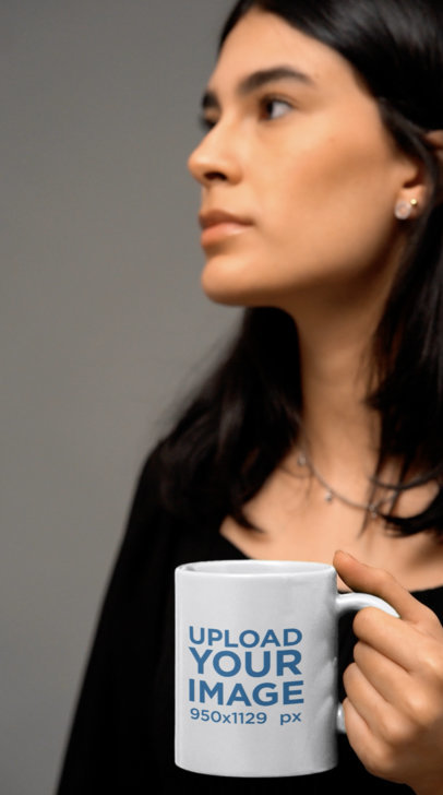 Video of a Woman Holding an 11 oz Mug at a Studio