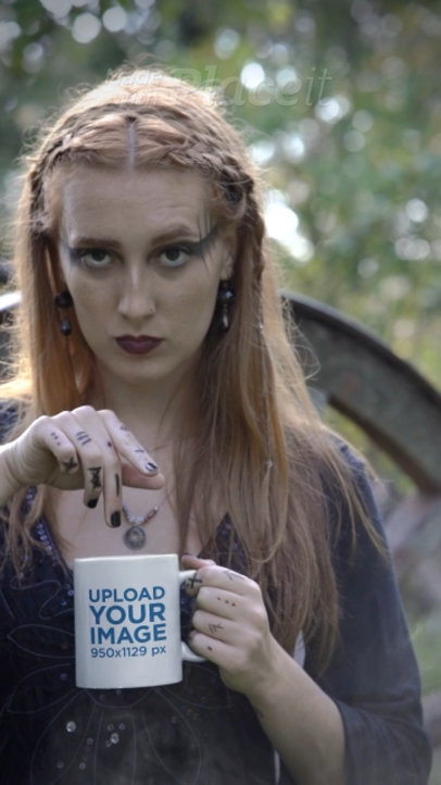 Mug Video Featuring a Serious Woman Wearing a Dark Outfit and Posing in a Wicca Setting