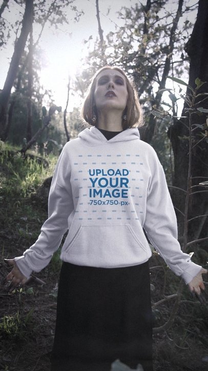Wicca Video Featuring a Woman Wearing a Pullover Hoodie in a Forest