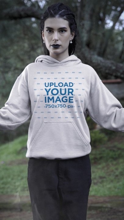 Video of a Serious Woman Wearing Hoodie Featuring a Wicca Theme