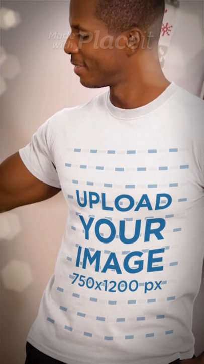 T-Shirt Video of a Man Placing a Sphere on a Christmas Tree 6033v