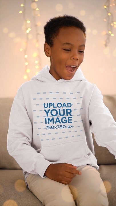 Christmas-Themed Video Featuring a Boy in a Pullover Hoodie