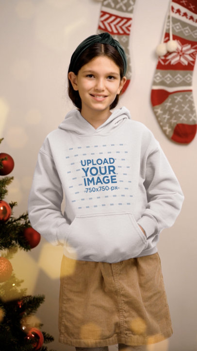 Pullover Hoodie Video Featuring a Smiling Girl in a Christmas-Themed Setting