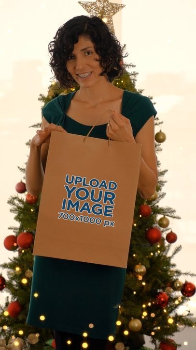 Video of a Happy Woman Carrying a Christmas Gift Bag