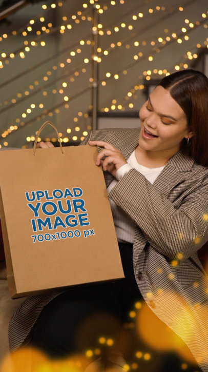 Video of a Surprised Smiling Woman Opening a Gift Bag for Christmas